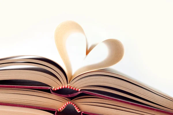 Old books and heart shape — Stock Photo, Image