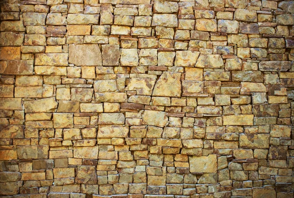 Bakgrund i form av en mur från Granit sten — Stockfoto