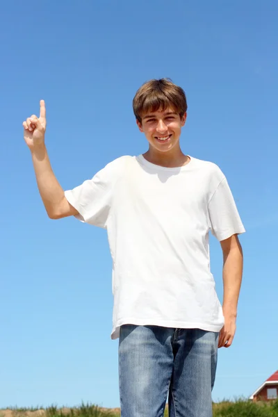 Adolescente con el dedo arriba — Foto de Stock
