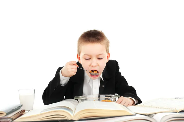 Schooljongen eet — Stockfoto