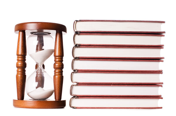 Hourglasses and book isolated on white background