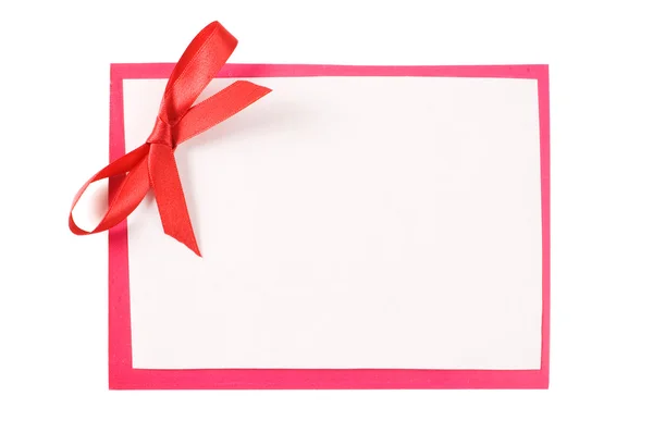 Färg papper med en röd rosett — Stockfoto