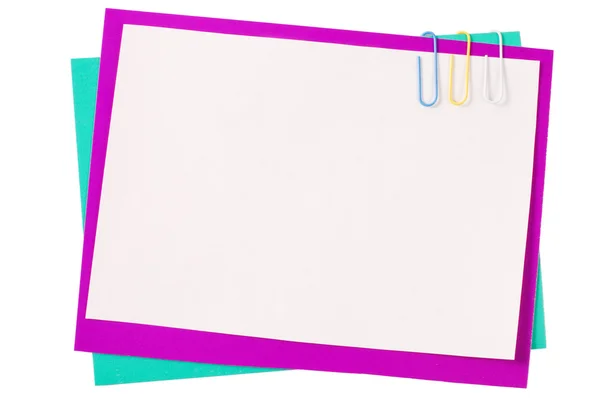 stock image Colour paper with a paper clip