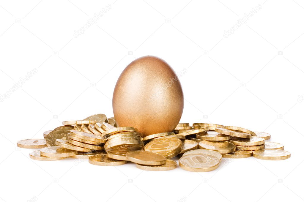 Gold egg in golden coins isolated on white