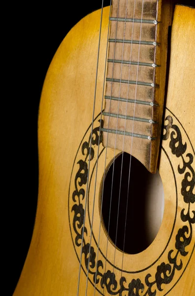 The acoustic guitar on a black — Stock Photo, Image