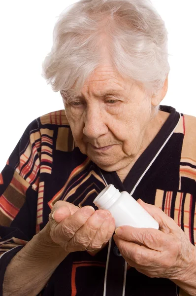 De oudere vrouw met tabletten — Stockfoto