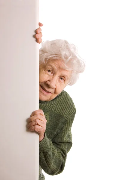 De oude vrouw spionnen geïsoleerd op witte achtergrond — Stockfoto