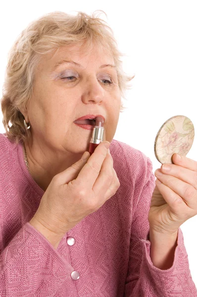 The elderly woman does a make-up — Stock Photo, Image