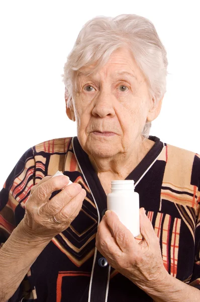 A mulher idosa com comprimidos — Fotografia de Stock