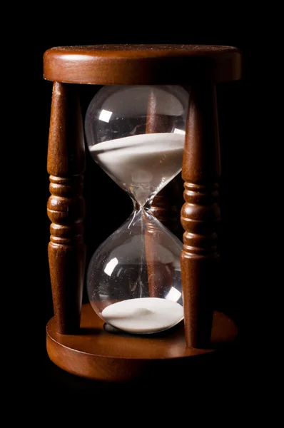 The old hourglasses on a black — Stock Photo, Image