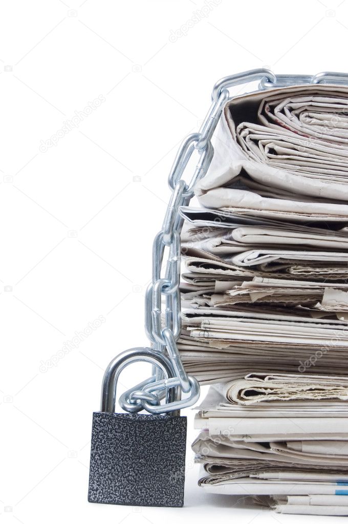 Pile of newspapers with chains