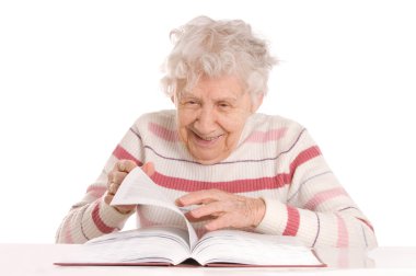 The elderly woman reads the book clipart