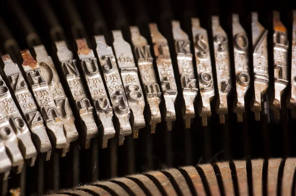 Texto antiguo mecanografía letra máquina de escribir barra de tipos — Foto de Stock
