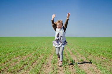 The girl runs across the field clipart