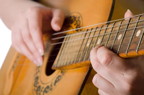 The woman plays an acoustic guitar — Stock Photo, Image