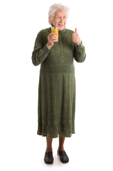 Mujer mayor con un vaso de jugo — Foto de Stock