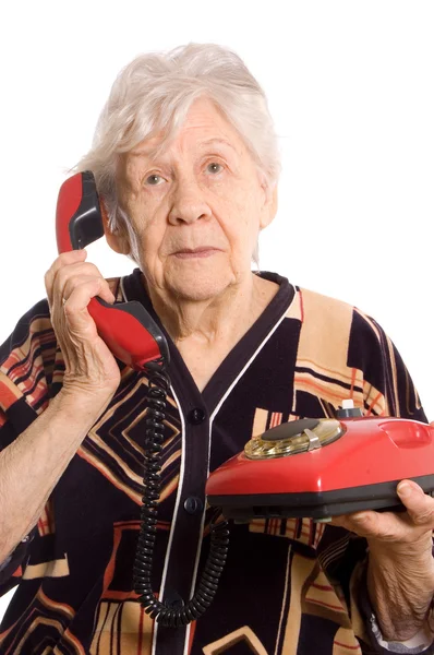 De oudere vrouw spreekt op telefoon — Stockfoto