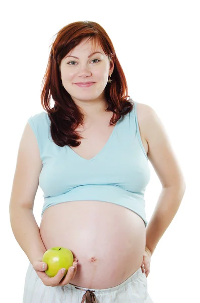 Η έγκυος γυναίκα με ένα μήλο — Φωτογραφία Αρχείου