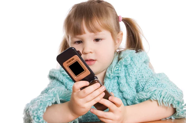 The little girl speaks by phone — Stock Photo, Image