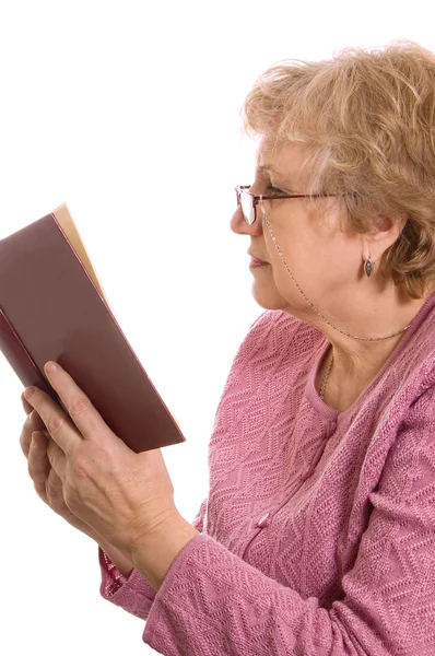 The elderly woman reads the book — Stock Photo, Image