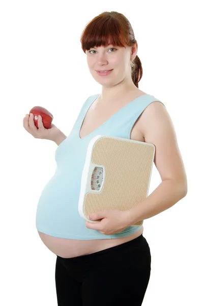 Hamile kadın bir ölçüm bandı ile — Stok fotoğraf