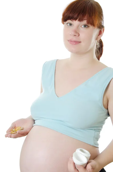 Беременная женщина с измерительной лентой — стоковое фото