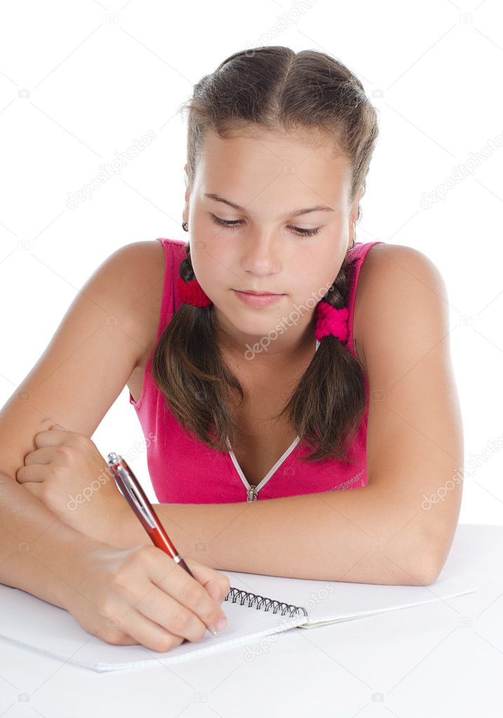 The young girl writes to writing-books