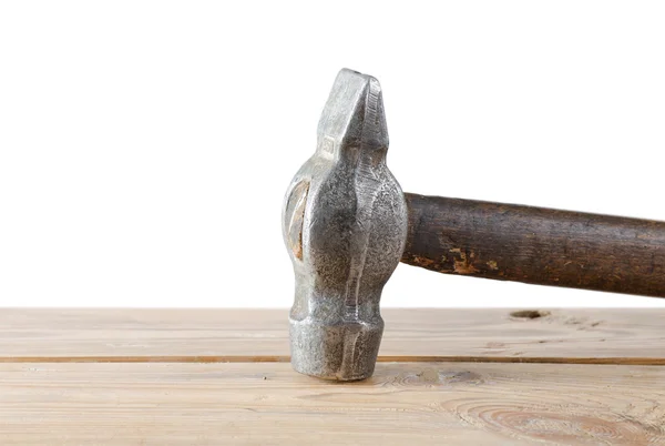 Hammer on an old board — Stock Photo, Image