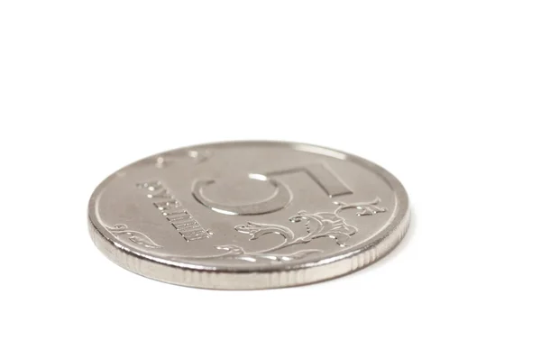 Монета поверх белого — стоковое фото