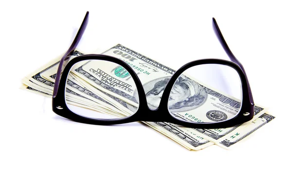 Brille auf Hundert-Dollar-Scheinen lizenzfreie Stockfotos