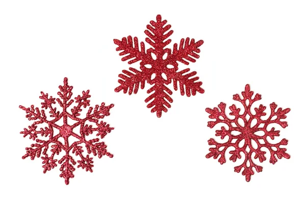 Tre röda glitter snöflingor — Stockfoto