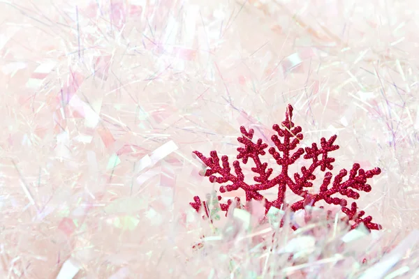 Snowflake in tinsel — Stock Photo, Image