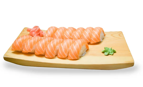 Uppsättning av japansk sushi på en träplatta — Stockfoto
