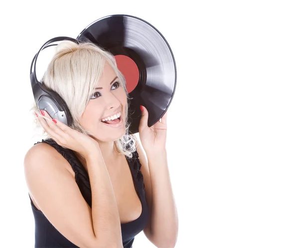 Rubia emocional en auriculares con disco de vinilo sobre blanco — Foto de Stock