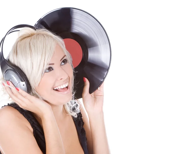 Emotional blonde in headphones with vinyl record over white — Stock Photo, Image