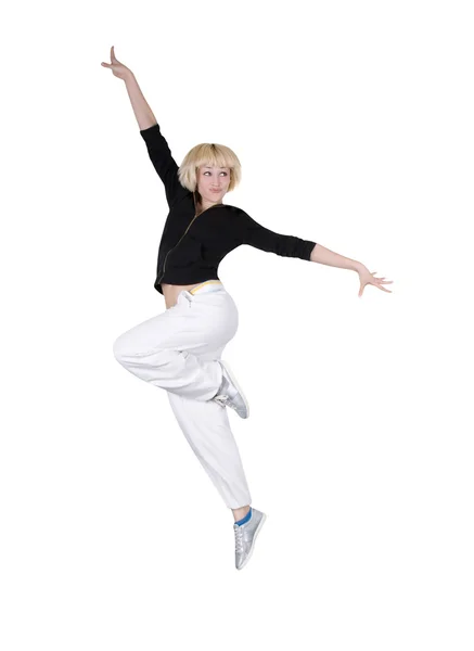 Дівчина-підліток танцює хіп-хоп на білому тлі — стокове фото