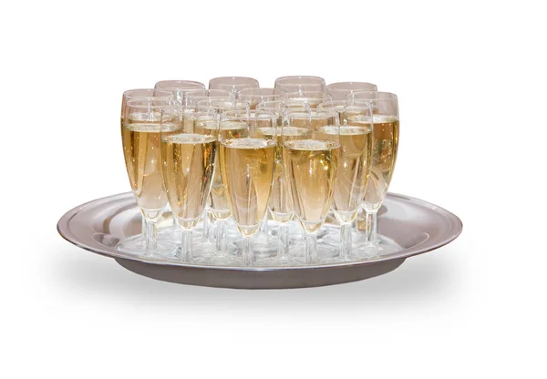 Muitos copos cheios de champanhe na bandeja — Fotografia de Stock