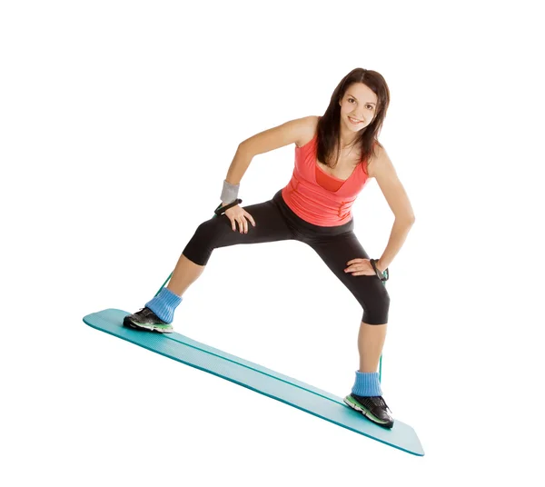 Attraente giovane femmina con espansore fitness in stretching — Foto Stock