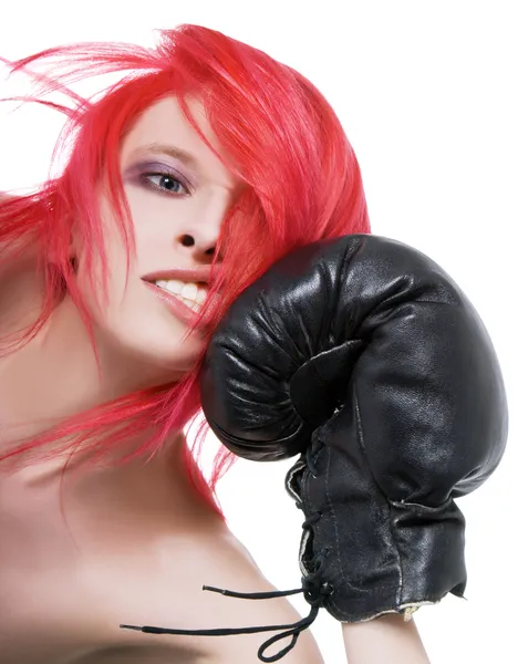 Red-hair girl receives a knockout blow in the face of boxing glo — Stock Photo, Image