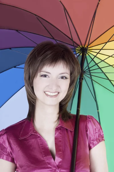 Gyönyörű nő és színes esernyő — Stock Fotó