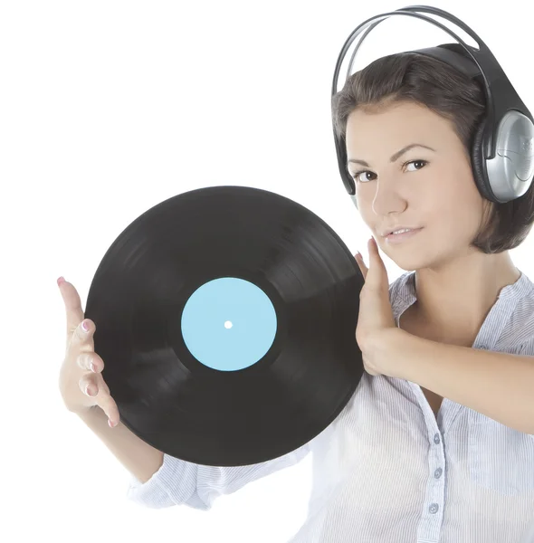 Emotional brunette in headphones with vinyl record over white — Stock Photo, Image