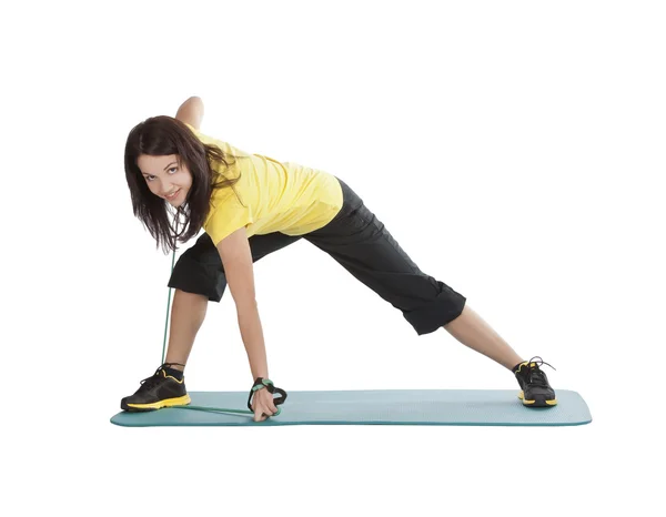 Attraktiv ung kvinna med fitness expander i stretching — Stockfoto