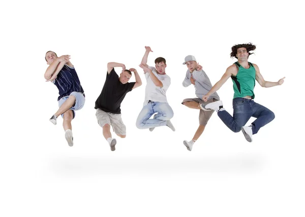 Groupe de jeunes adolescents sautant par-dessus blanc — Photo