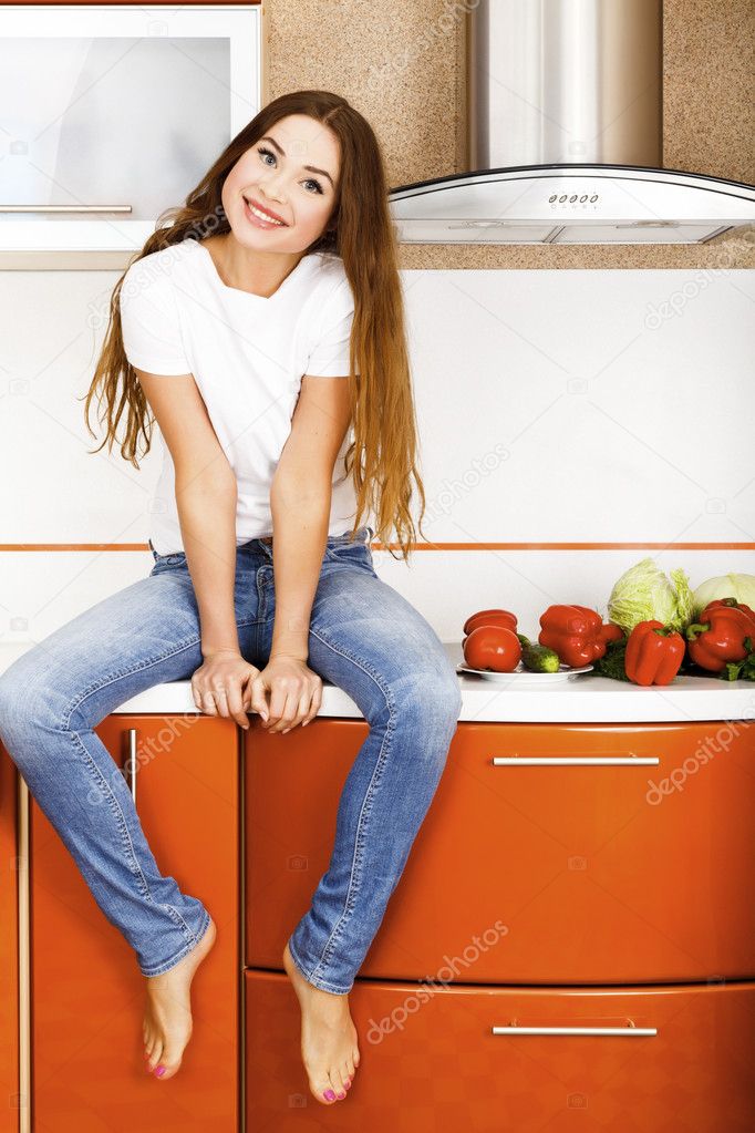 Beautiful caucasian woman in the kitchen