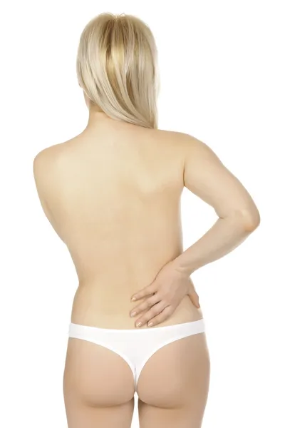 Kvinna massera smärta tillbaka isolerade över en vit bakgrund. — Stockfoto