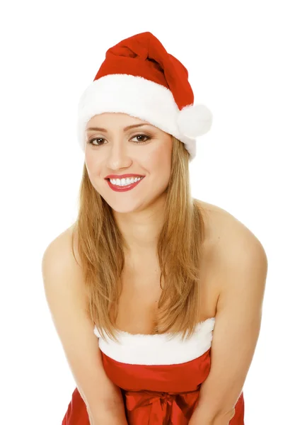 Schöne junge Frau in Rot mit Weihnachtsmütze. — Stockfoto