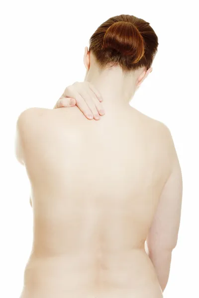 Osteocondrosis - mujer que masajea el dolor de espalda — Foto de Stock