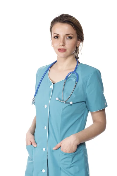 Kvinna läkare poserar mot vit bakgrund — Stockfoto