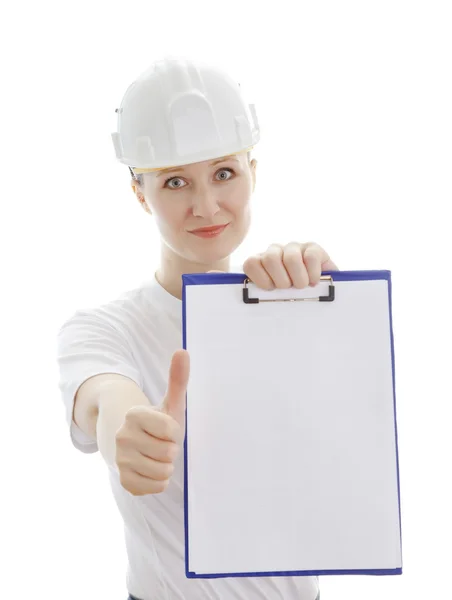 Woman in the white helmet showing the blank page — Stock Photo, Image