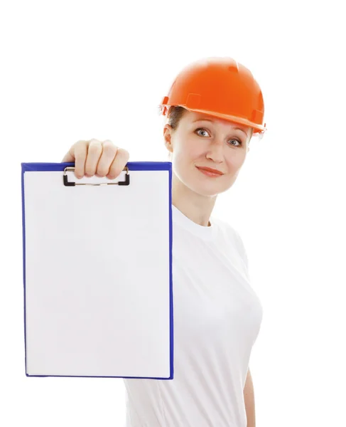 Woman in the bright orange helmet showing the blank page — Stock Photo, Image